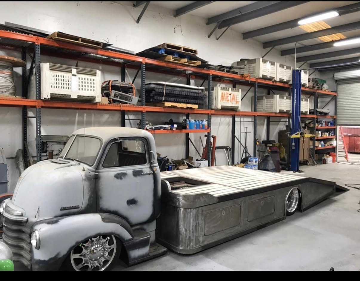 Vintage truck undergoing restoration in Squotty's Garage workshop